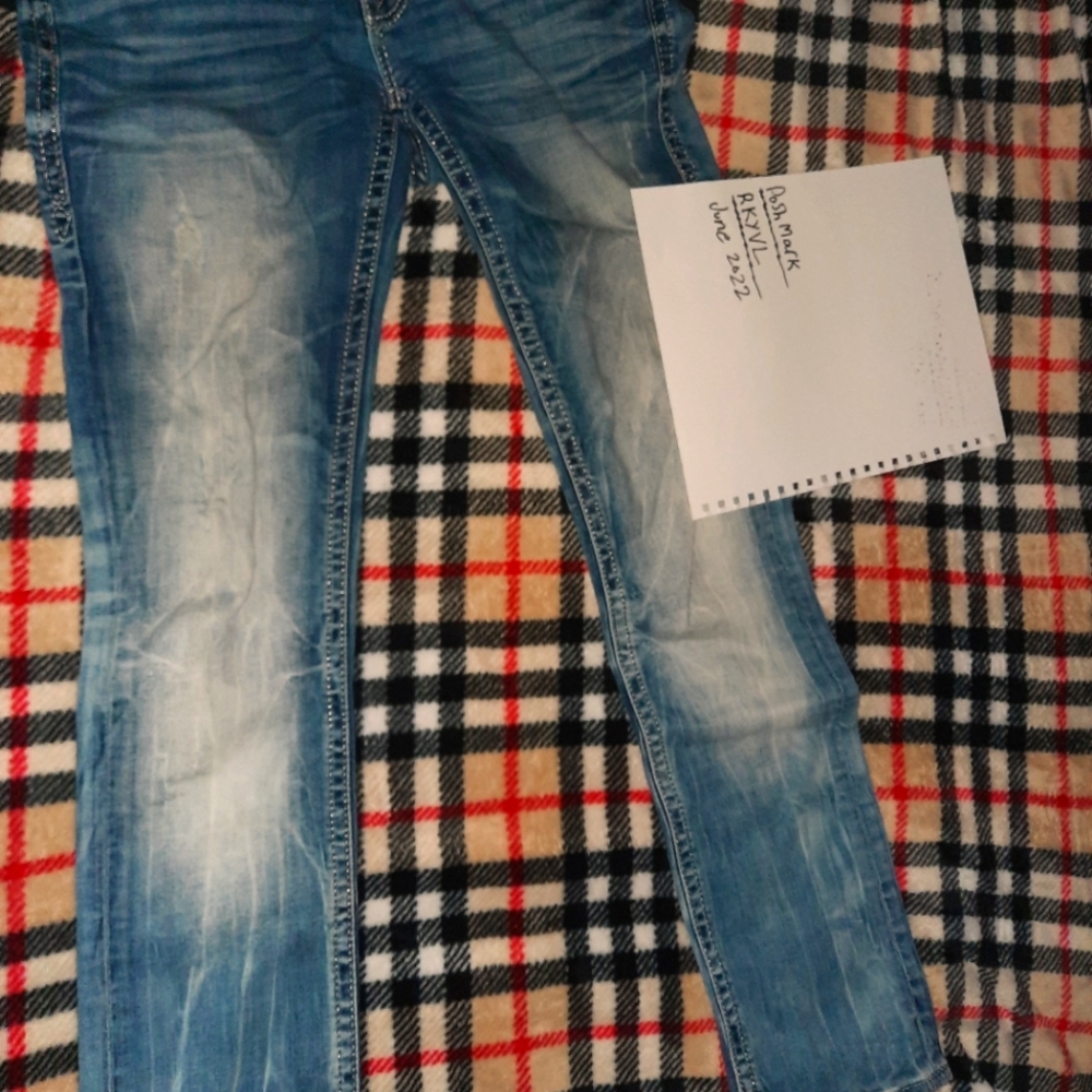 Size 28 distressed rock revival jeans